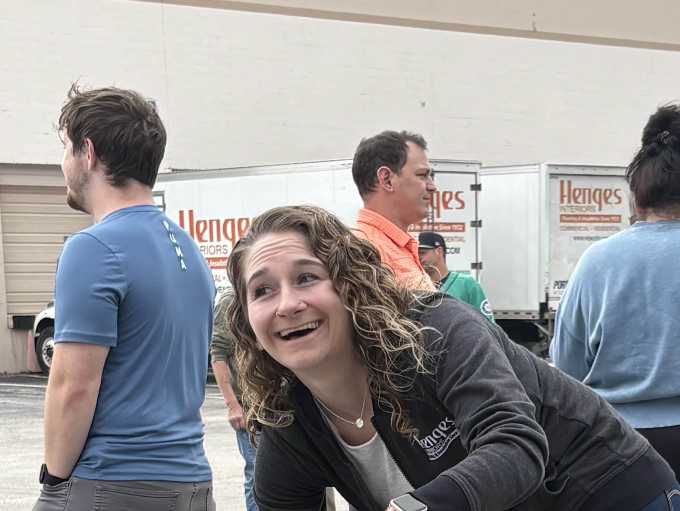 Henges team members sharing a laugh at a company cookout